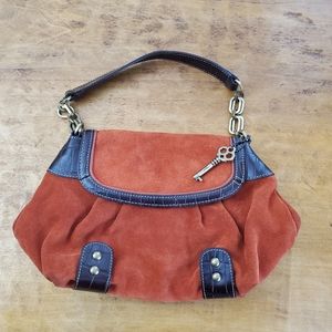 Fossil purse made of a deep pumpkin suede with dark brown croc embossed leather
